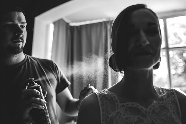 Bride having hairspray applied - Picture by Andrew Keher Photography