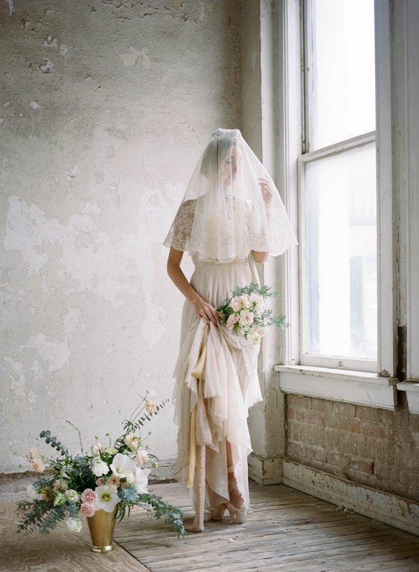 Ballerina bride with veil at window