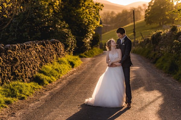 Bride and groom in road - Picture by Andrew Keher Photography