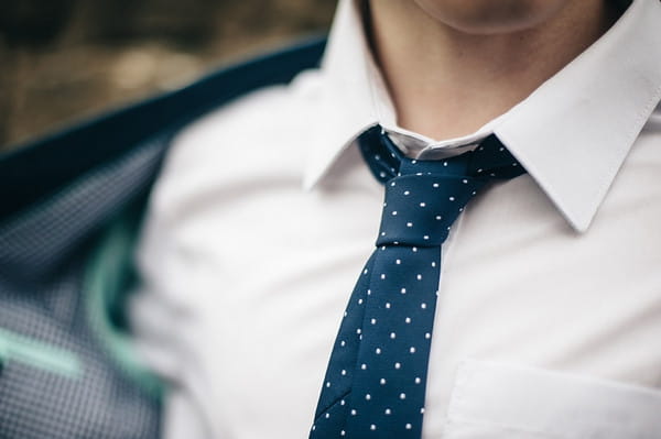 Blue tie with white spots