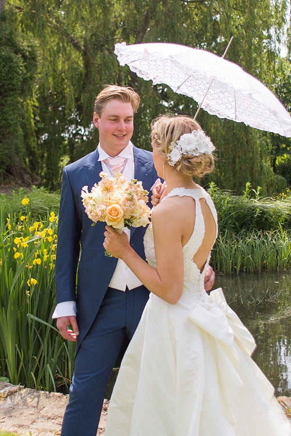 Bride and groom with parasol