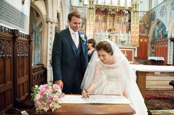 Bride signing register
