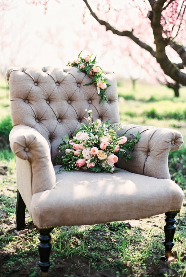 Wing back chair with flowers