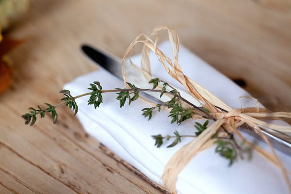 Knife wrapped in string with thyme