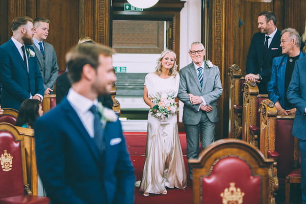 Father walking bride down aisle at Islington Town Hall