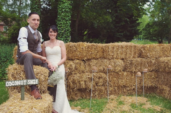 Bride and groom on hay bales