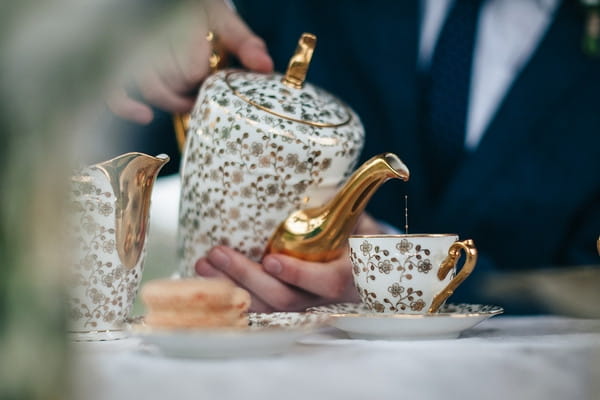 Pouring tea from teapot