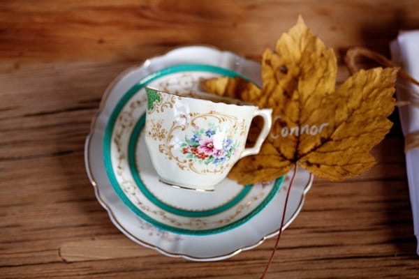 Teacup and autumn leaf on wedding table