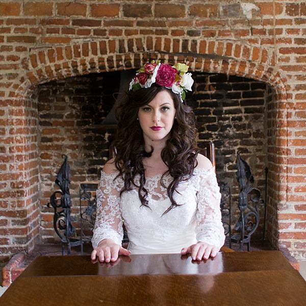 Bride with flower crown sitting at table