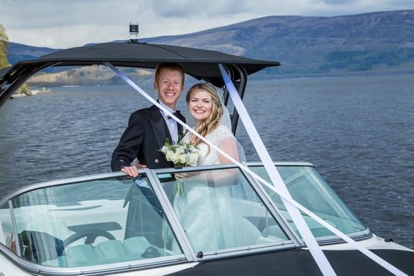 Bride and groom on speed boat