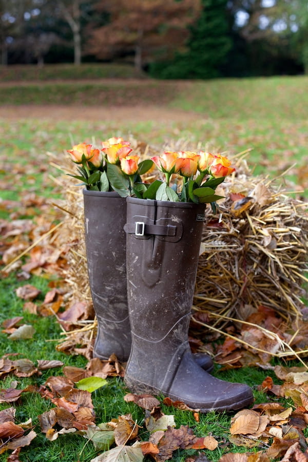 Wellington boots full of wedding flowers