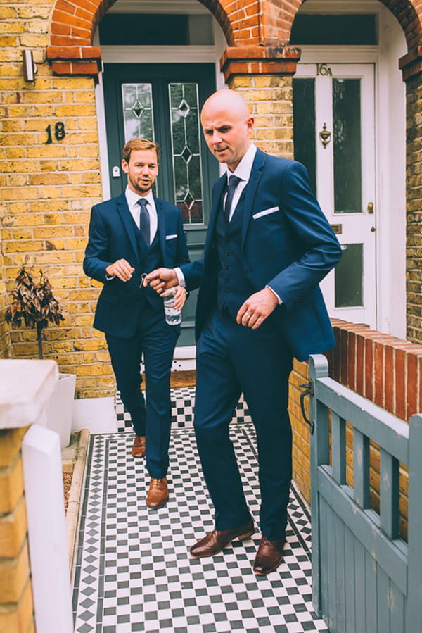 Groom and best man leaving house to go to wedding