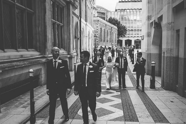 Wedding guests walking in London