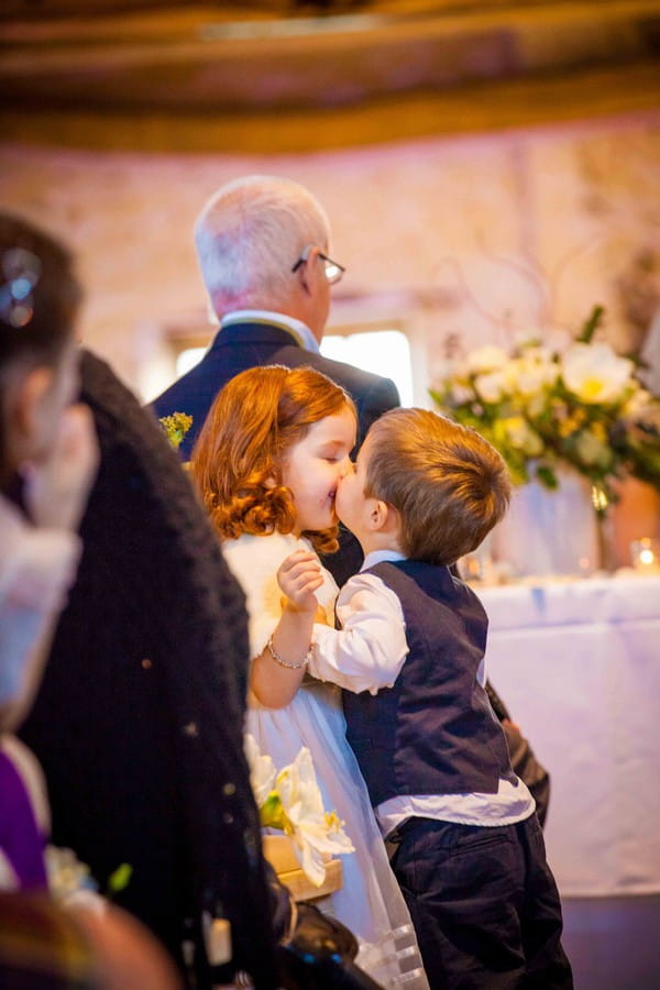 Pageboy kissing flower girl - Picture by Amanda Karen Photography