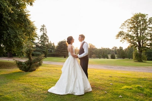 Bride and groom in grounds of Moor Park Mansion