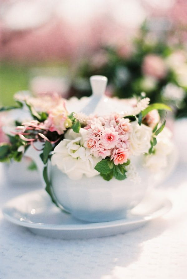 teapot full of pink flowers