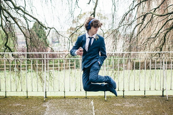 Young groomsman jumping