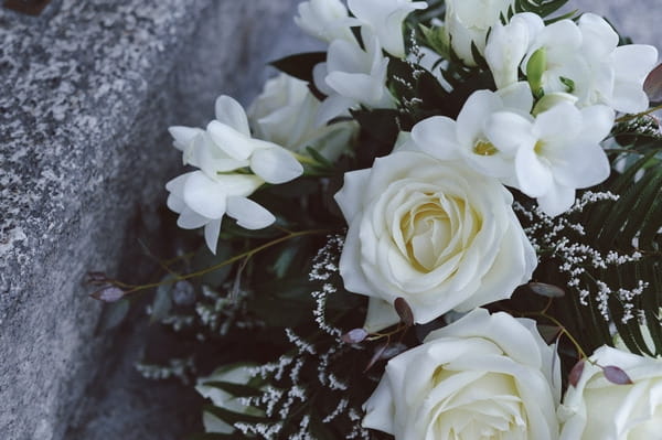 White roses in wedding bouquet