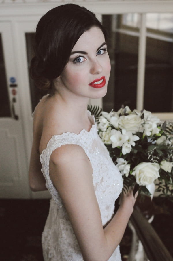 Retro bride holding bouquet