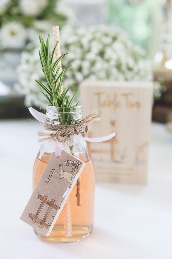 Bottle with rosemary wedding name tag