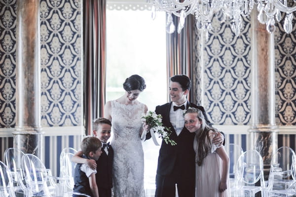 Retro bride, groom, flower girl and pageboys