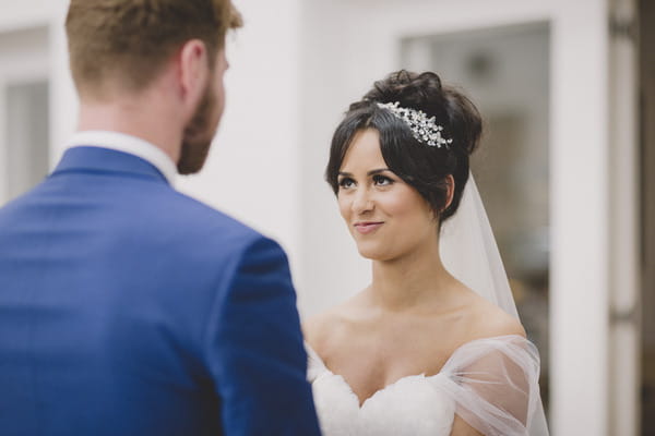 Bride looking into groom's eyes