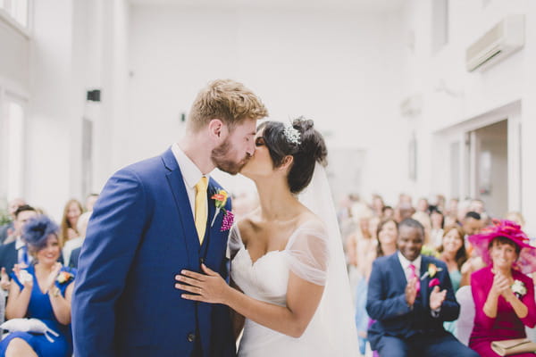 Bride and groom kiss