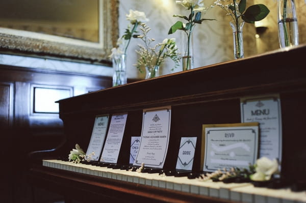 Retro wedding stationery on piano