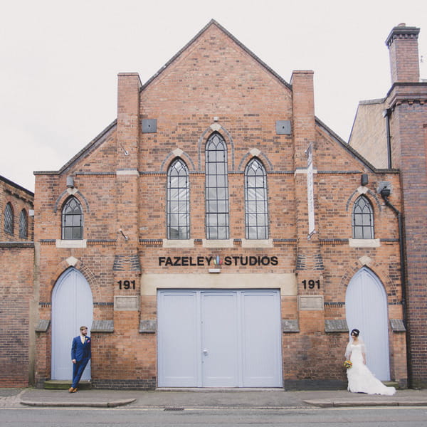 Bride and groom in front of Fazeley Studios building