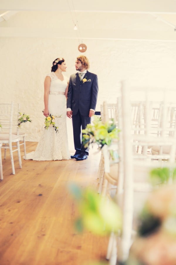 Bride and groom in ceremony room at Cosawes Barton