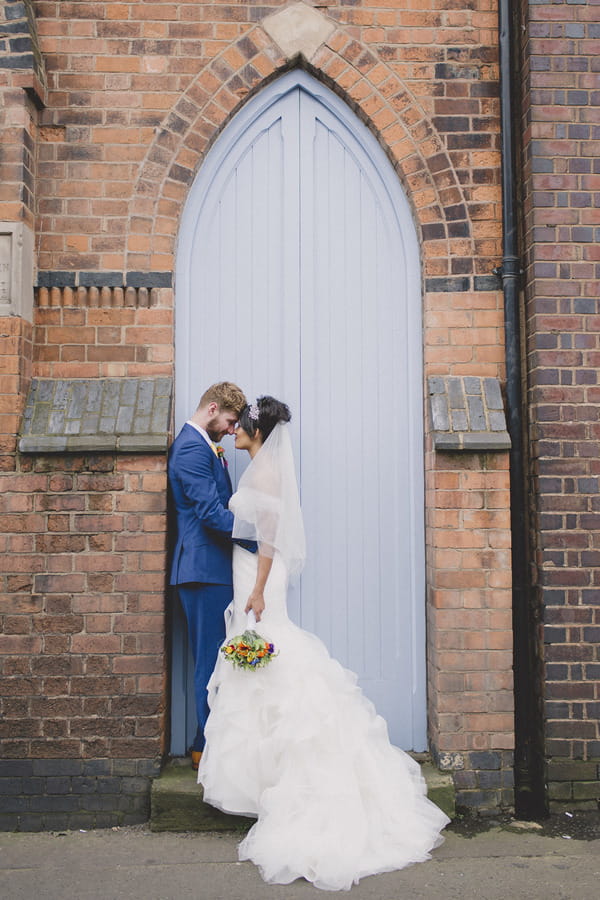 Bride and groom in doorway of Fazeley Studios