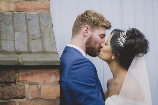 Bride and groom kiss