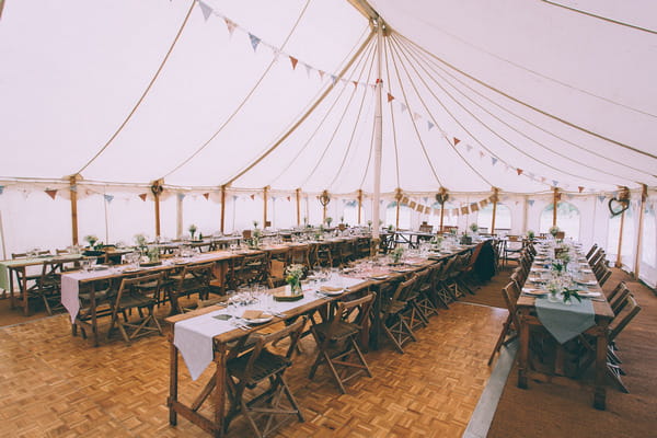 Long wedding tables in marquee