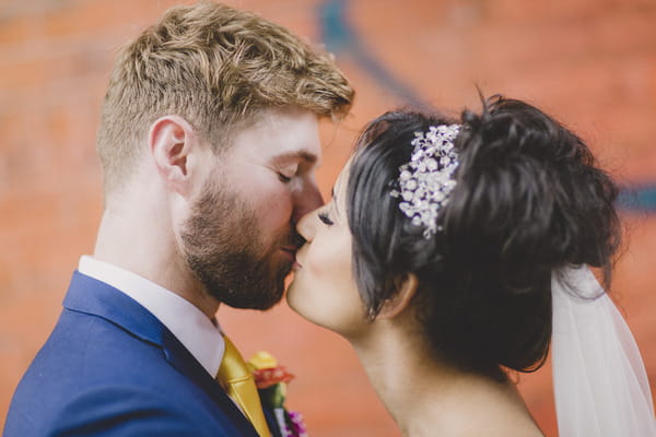 Bride and groom kiss