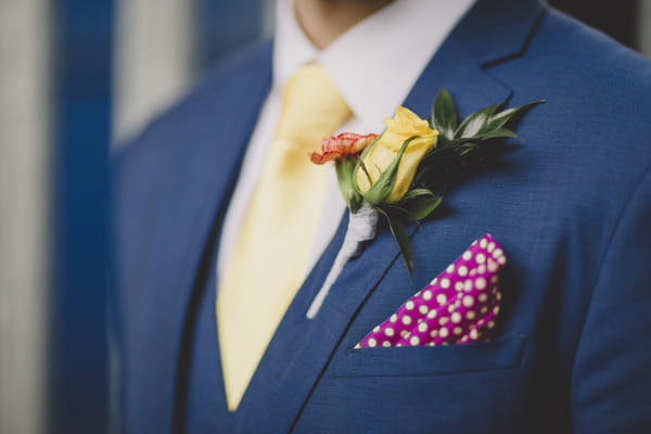 Groom's buttonhole and pink pocket handkerchief