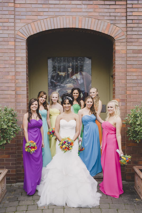 Bride with bridesmaids in colourful dresses