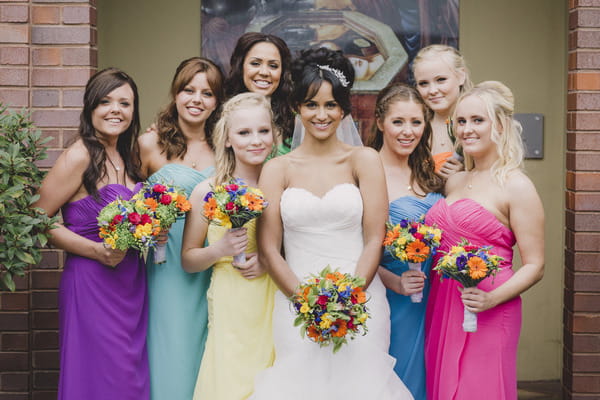 Bride with bridesmaids in colourful dresses