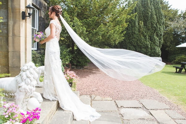 Bride's veil blowing in wind