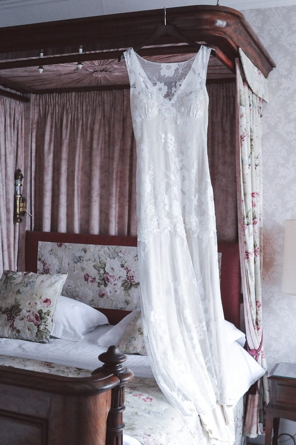 Wedding dress hanging in bedroom at Duke of Cornwall Hotel