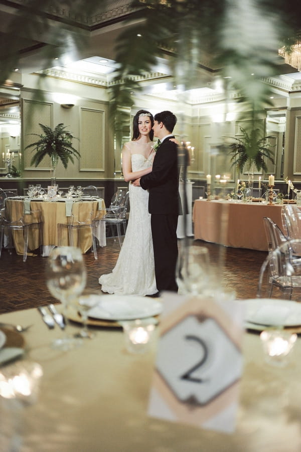 Retro bride and groom dancing in ballroom at Duke of Cornwall Hotel