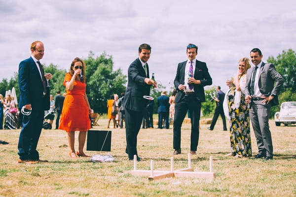Wedding guests playing lawn games