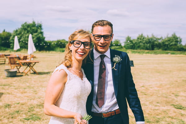 Bride and groom wearing glasses