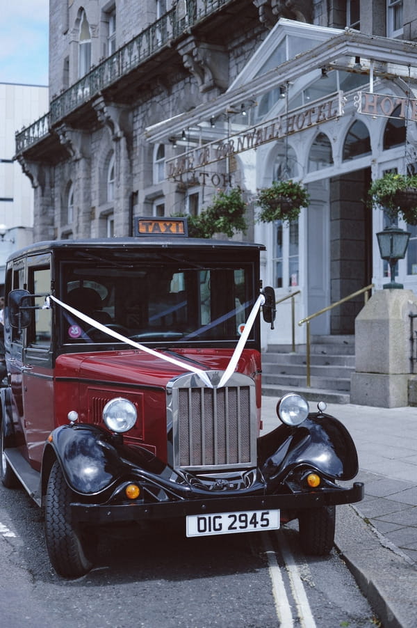 Vintage taxi outside Duke of Cornwall Hotel