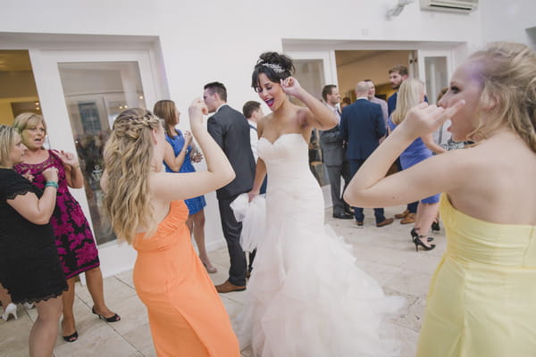 Bride dancing with wedding guests