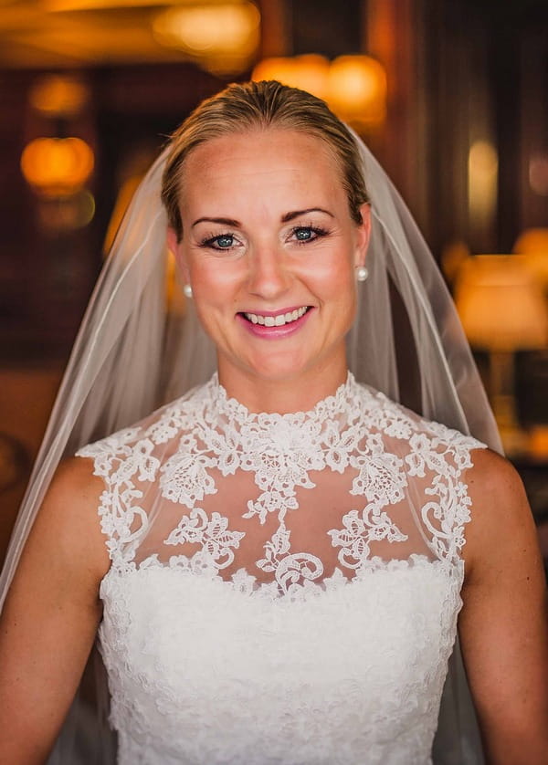 Bride with lace detail on top of wedding dress