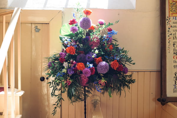 Bright wedding flowers in church