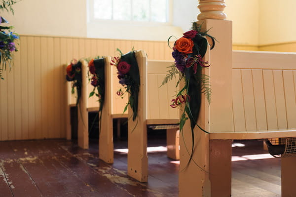 Bright pew end flowers