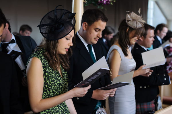 Wedding guests reading