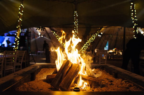 Log fire in wedding tipi