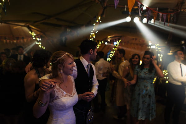 Bride and groom walk to dance floor